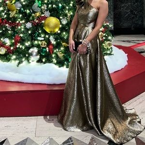 Gorgeous gold one shoulder gown by MacDougall.